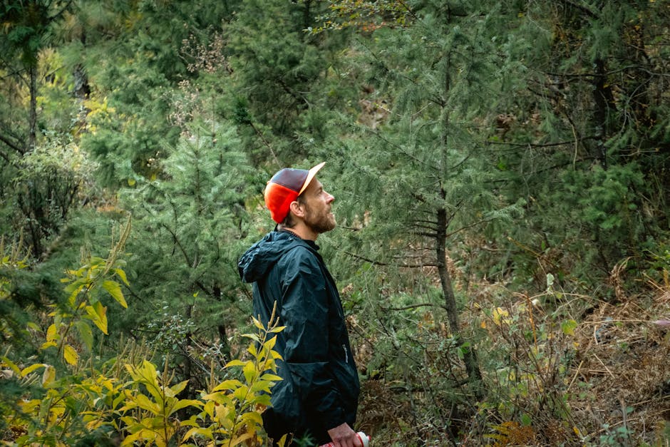 Man in a forest in Karnali Province, Nepal, exemplifying adventure tourism with nature exploration.